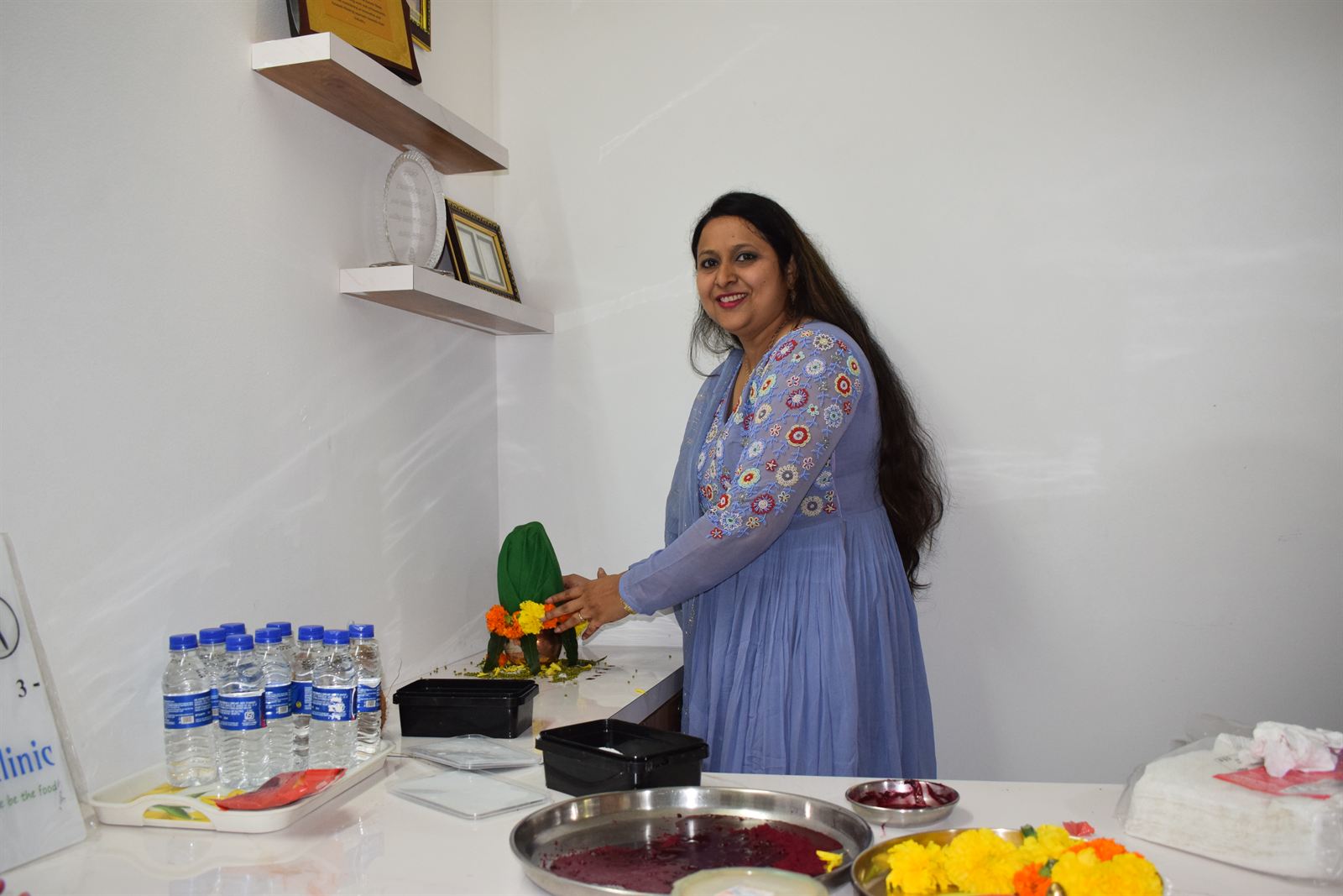 Dietitian Rupal Jasani performing the opening-day puja at Rupal's Diet Clinic