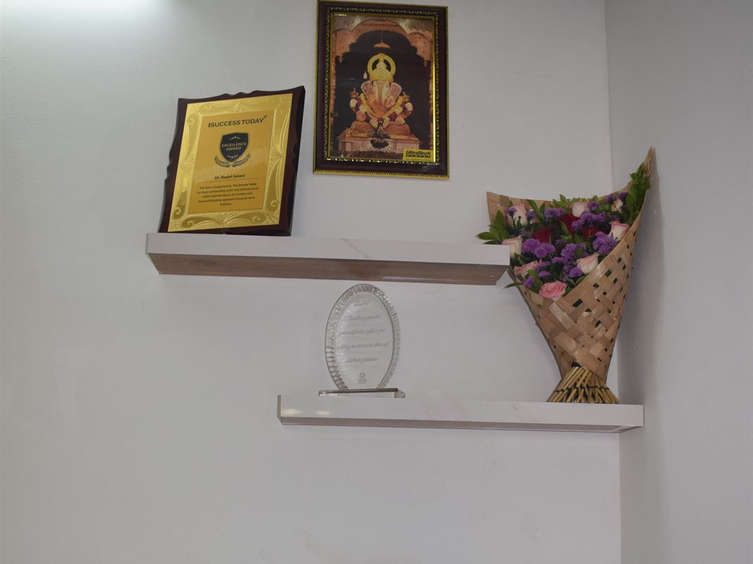 Recognition shelf at Rupal's Diet Clinic with The Success Today award plaque
